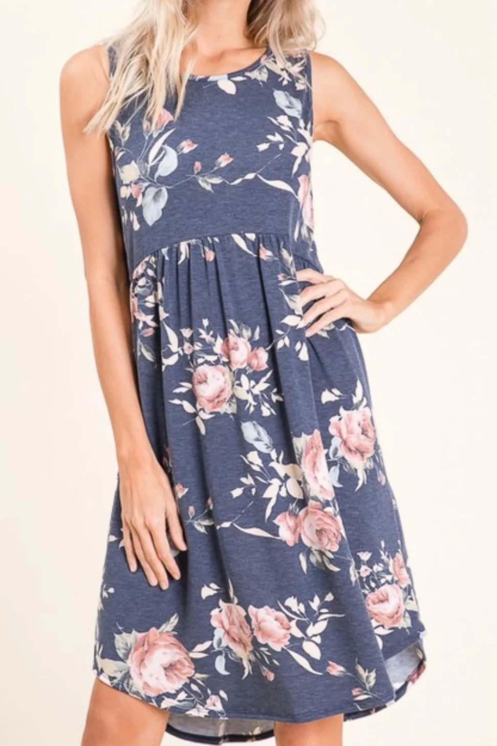 SLEEVELESS FLORAL EMPIRE WAIST KNIT DRESS