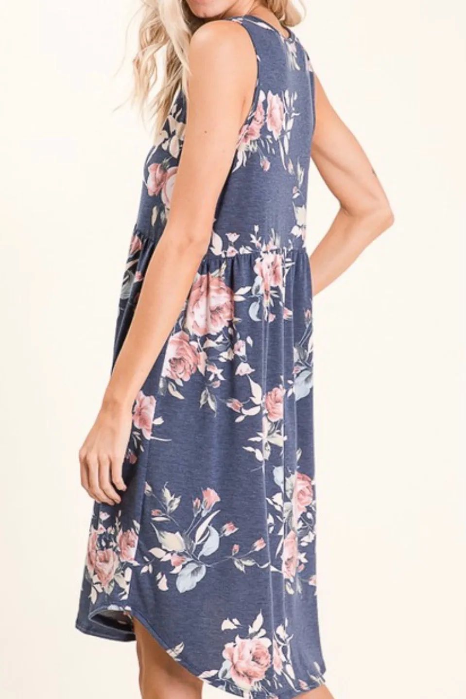 SLEEVELESS FLORAL EMPIRE WAIST KNIT DRESS